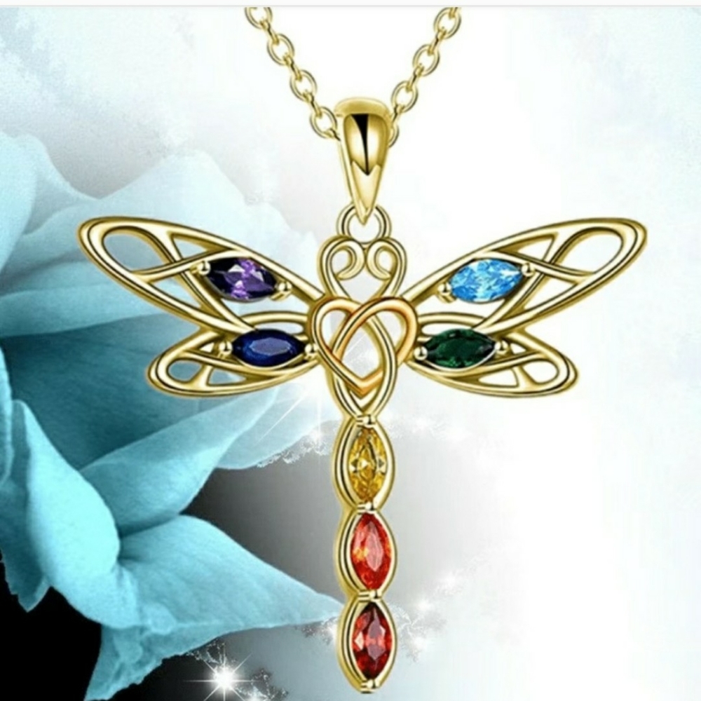 Brand new goldtone dragonfly necklace accented with colorful rhinestones.